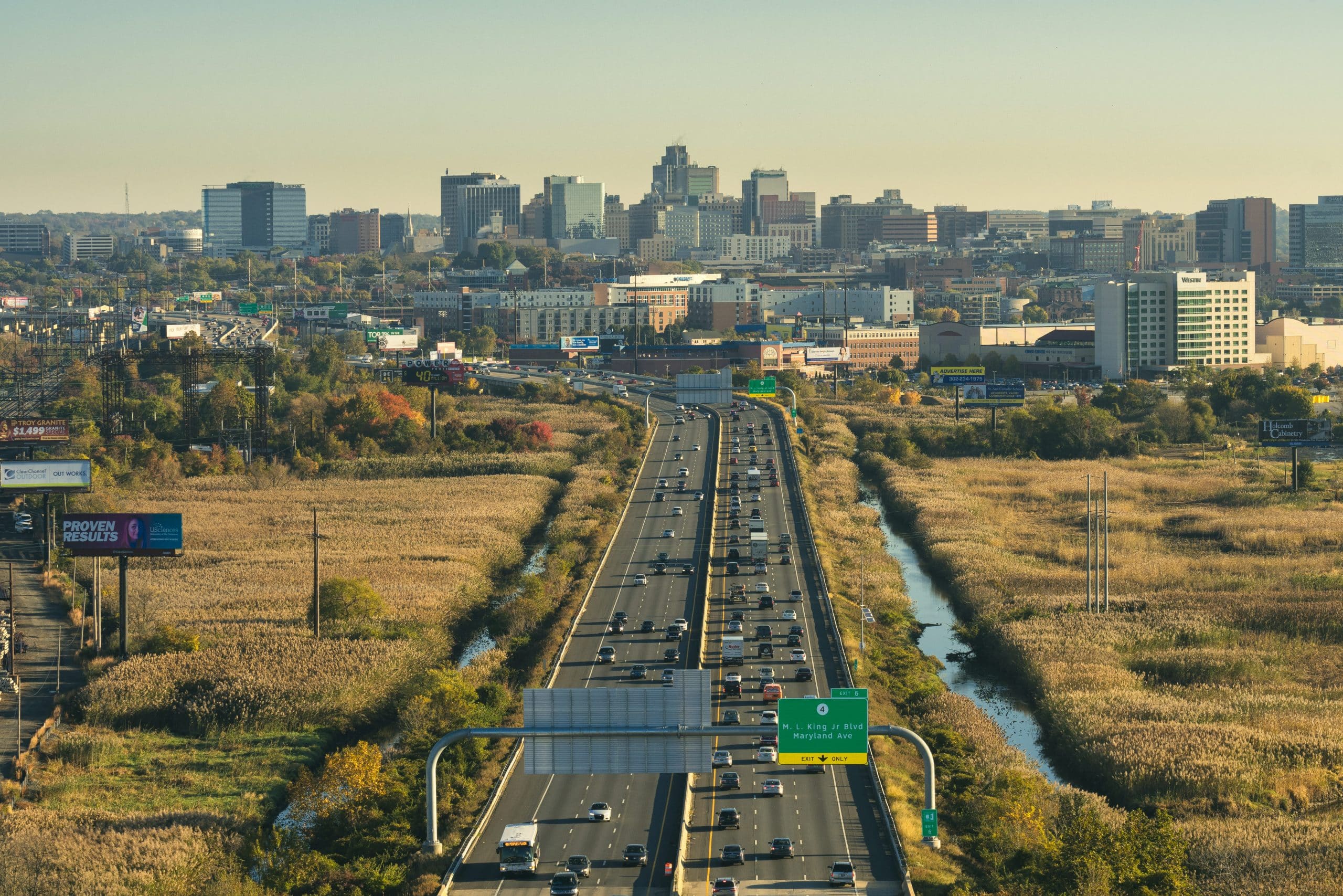 Aerial view of highway leading into city landscape of Wilmington, DE